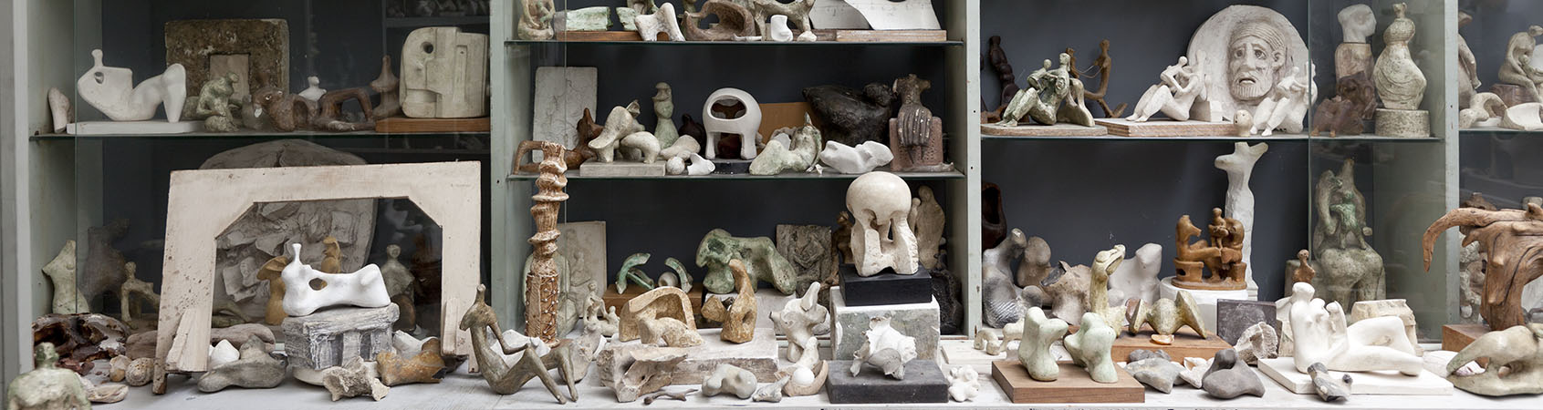 Plaster maquettes arranged on shelves in Henry Moore's Bourne Maquette Studio, Perry Green. For more details click here. photo: Jonty Wilde